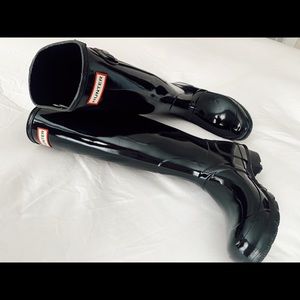 Tall, glossy Hunter boots